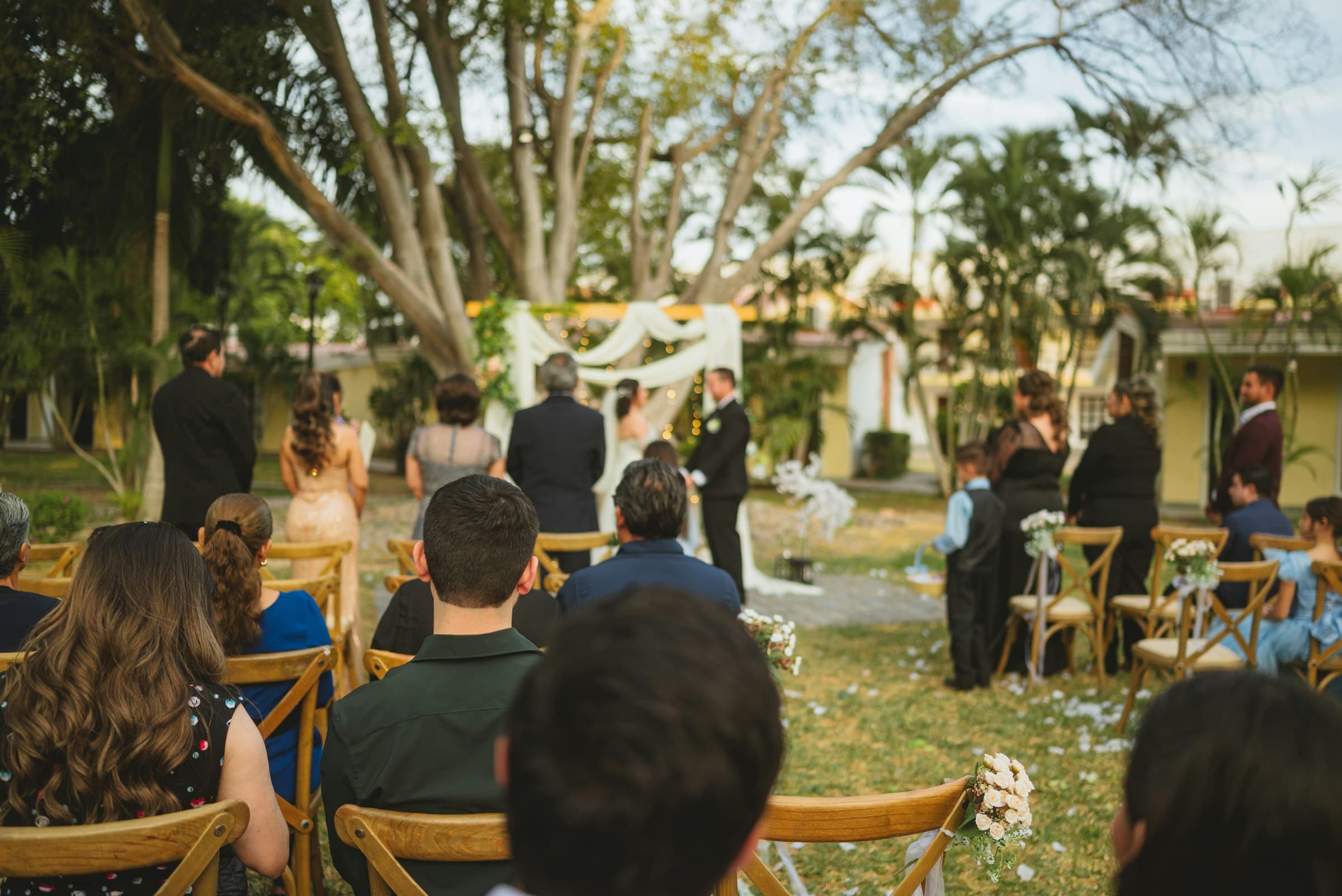 Outdoor wedding ceremony with seated guests